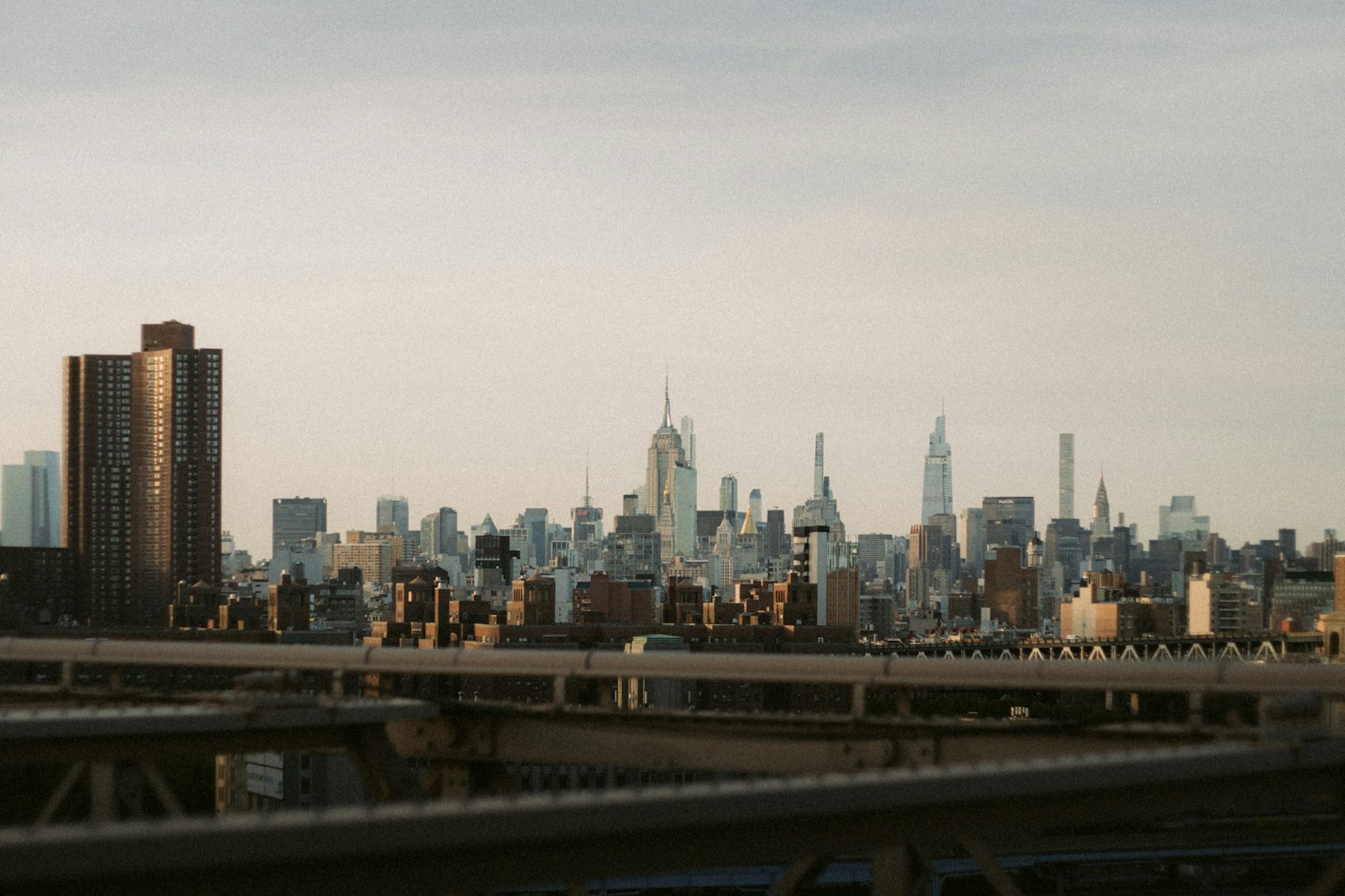 A view of a city skyline from a bridge